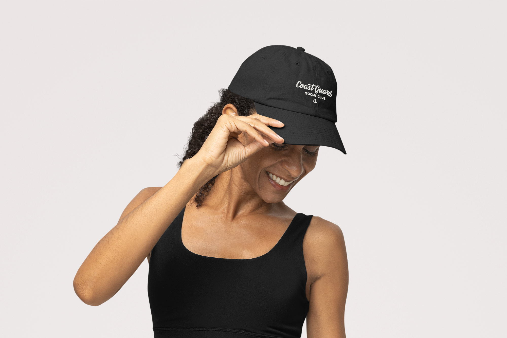 Mockup of a joyful woman holding her otto cap dad hat in a studio m40198